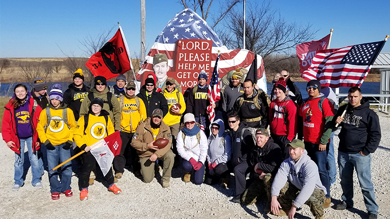 Student Veterans from Nebraska and Iowa meet at Freedom Rock in Menlo, IA during annual Ruck March to raise awareness about veteran health concerns